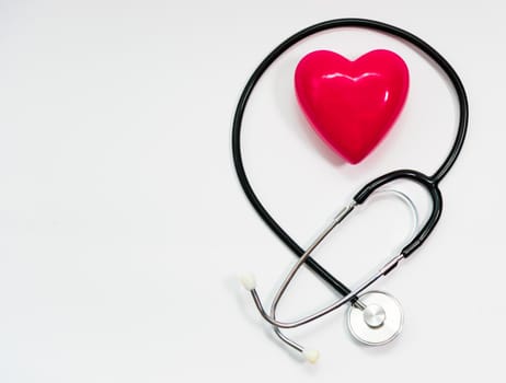 Stethoscope for measuring blood pressure on a white background, heart
