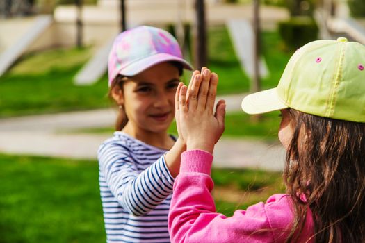 children holding hands in the park.selective focus.kids