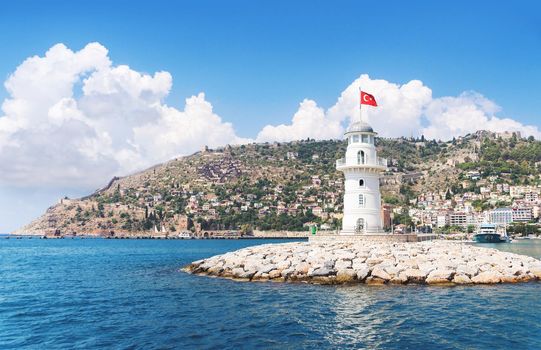 Alanya lighthouse with fortress on the background