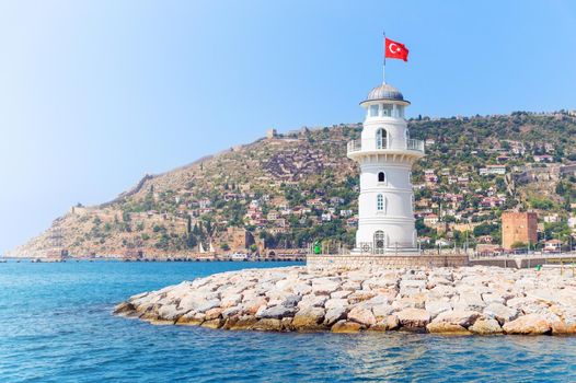 Alanya lighthouse with fortress on the background