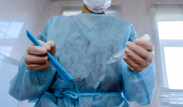 Respiratory mask nurse with test for fast-spreading coronavirus originating from Wuhan, China