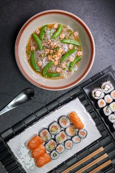 Various dishes of Asian cuisine with typical sushi