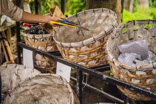 Man separately picks up trash. Separate garbage collection concept.