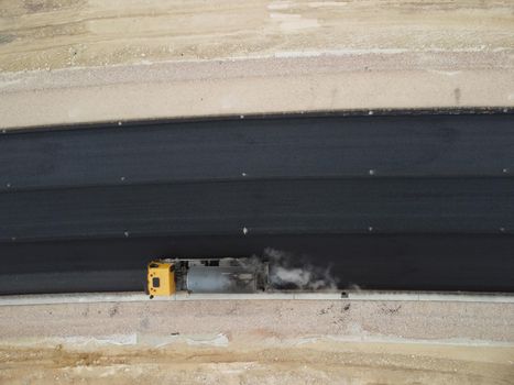 Aerial drone shot Road construction in progress in wild nature canyon.