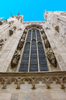 Milan Duomo cathedral exterior window blue sky