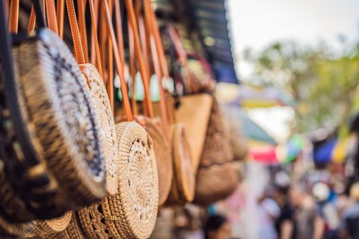 Typical souvenir shop selling souvenirs and handicrafts of Bali at the famous Ubud Market, Indonesia. Balinese market. Souvenirs of wood and crafts of local residents.