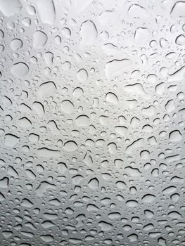 Abstract texture of water drops on a glass.