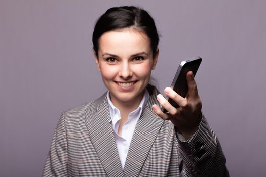 woman in a white shirt and glasses communicates on the phone. High quality photo