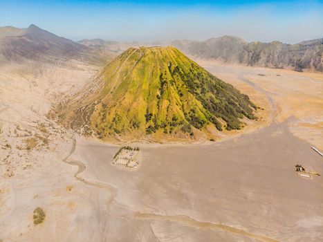 Aerial shot of the Bromo volcano and Batok volcano at the Bromo Tengger Semeru National Park on Java Island, Indonesia. One of the most famous volcanic objects in the world. Travel to Indonesia concept.