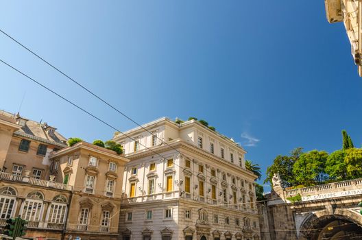 Palazzo Lercari-Parodi palace classic typical buildings on Piazza del Portello square and tunnel in historical centre of old european city Genoa Genova with blue clear sky background, Liguria, Italy