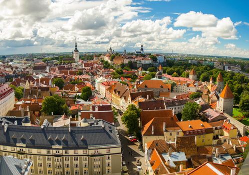 Panoramic view of Old Town of Tallinn with traditional red tile roofs, medieval churches, towers and walls, Toompea Hill from St. Olaf's Church Tower, Estonia