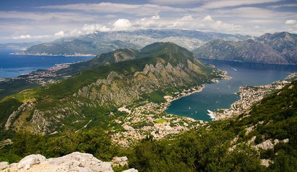 Top view of Boka Kotor bay and Old Town Kotor from Lovcen Mountain in front of Dinaric Alps mountains range, Montenegro