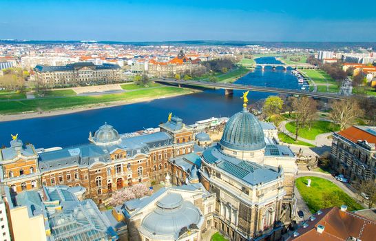 Panoramic view of Dresden city with bridges over Elbe river and old buildings from view platform of lutheran church of Our Lady Frauenkirche, Germany