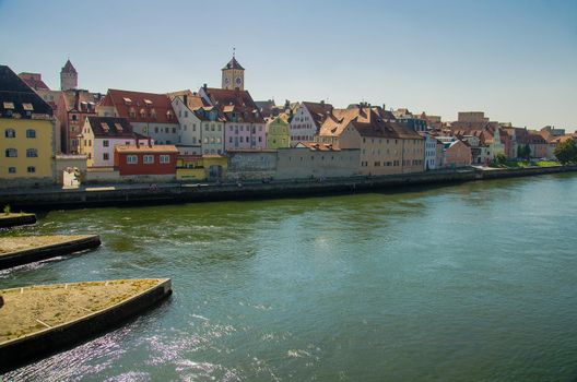 View of the old town of Regensburg, colourful buildings and the river Danube in Bavaria, Germany