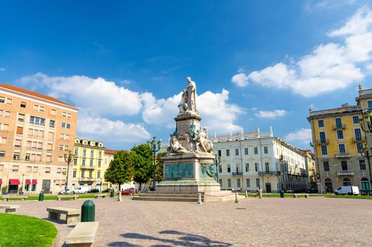 Monumento a Camillo Benso conte di Cavour statue on Piazza Carlo Emanuele II square with old buildings around in historical city centre of Turin Torino city in beautiful summer day, Piedmont, Italy