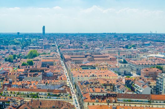 Aerial top panoramic view of Turin Torino city historical centre districts quarters, streets, churches, squares, buildings with orange tiled roofs, sightseeings, Piedmont, Italy