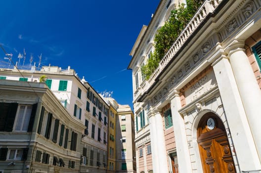 Facade of palace Palazzo Grimaldi della Meridiana classic style building with watch on doors on Piazza della Meridiana square in historical centre of old european city Genoa Genova , Liguria, Italy