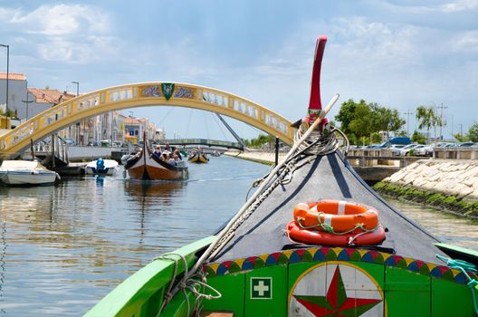 Traditional colorful boat Moliceiro on canal at the city of Aveiro Portugal