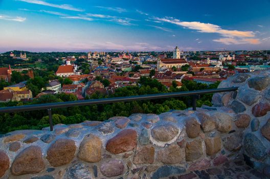 Panoramic view of Vilnius old town center with old buildings, churches and green trees from the Hill of Castle Tower Of Gediminas (Gedimino), Lithuania