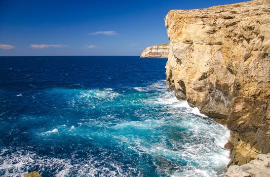 Place of collapsed Azure window in Dwejra Bay with Rocky coastline and cliffs, Gozo island, Malta