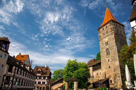 Old medieval Tower Tiergartnertorturm and traditional buildings on the streets of Nuremberg Nurnberg city, Mittelfranken region, Bavaria, Germany