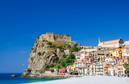 Beautiful seaside town village Scilla with old medieval castle on rock Castello Ruffo, colorful traditional typical italian houses on Mediterranean Tyrrhenian sea coast shore, Calabria, Southern Italy