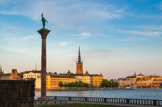 View of Monument Engelbrekt near Stockholm City Hall Stadshuset building, Riddarholmen island district with Riddarholm Church, typical sweden colorful gothic buildings, Lake Malaren water, Sweden