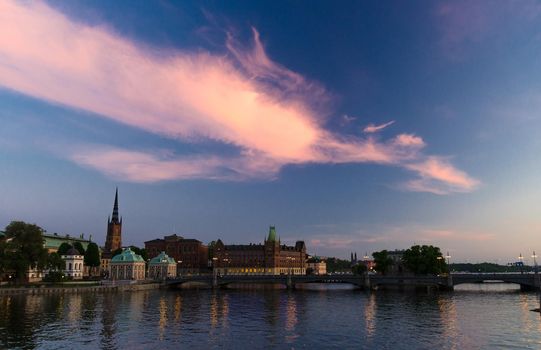 Scenic panoramic view of historical centre Riddarholmen with Riddarholm Church, Norstedts building, Vasabron bridge, The House of Nobility and Centralbron street, Gamla Stan, Stockholm, Sweden