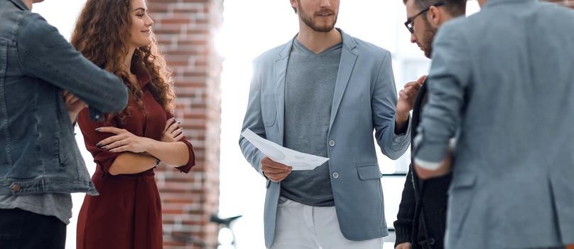 Business: Team having a serious argument, one colleague being the mediator