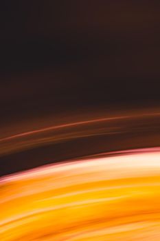 Vertical abstract background in warm colors. Space star in motion. Yellow orange arc lines in shades. Backdrop