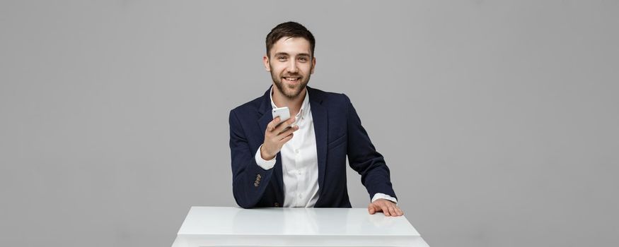 Business Concept - Portrait Handsome Business man playing phone with smiling confident face. White Background.Copy Space.