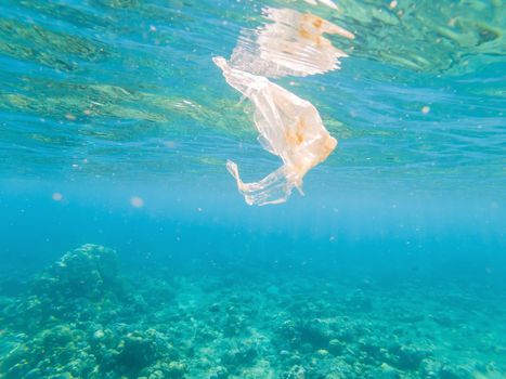 Plastic ocean. Pollution crisis as plastic bags, cups, straws and bottles end up in sea.