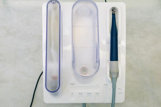 Ultrasonic scaler in the dental office. Dentistry Concept.