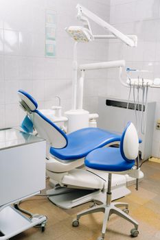 An empty chair in the dentist's office. Empty dentist's office.