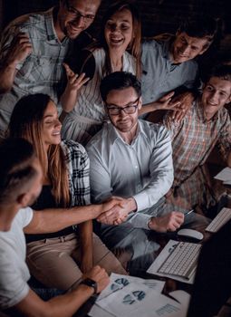 business people shaking hands over the Desk.the concept of teamwork