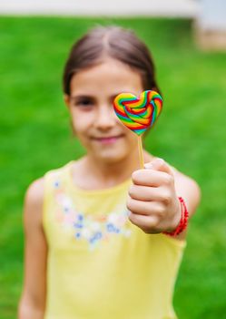 Lollipops in the hands of children. Selective focus. nature.