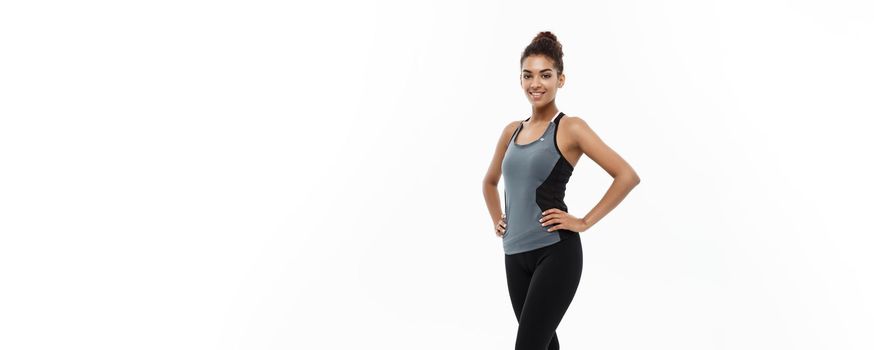 Healthy and Fitness concept - portrait of African American girl posing with fitness clothes