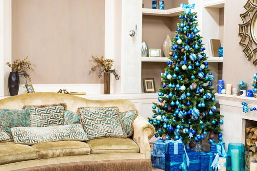 Beautiful New Year Interior with Christmas Tree in Corner. Couch with Pillows and Green Christmas Tree with Beautiful Presents.