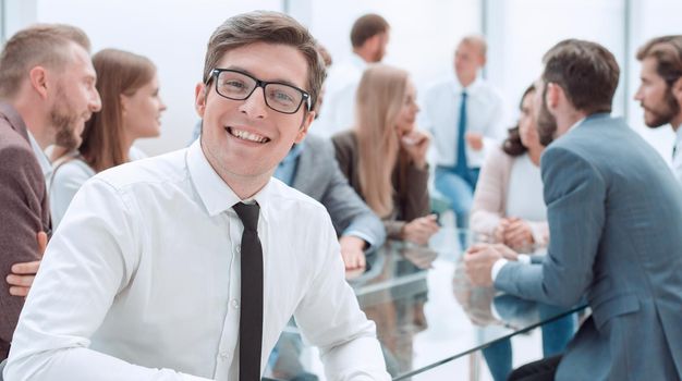 close up. happy businessman sitting in his office. business concept