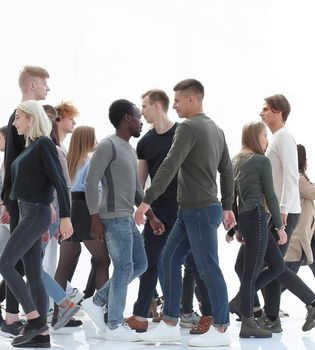 in full growth. diverse young people walking in different directions. photo with copy space