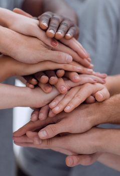 close up. young people making a tower of hands. the concept of unity