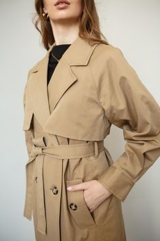A model in a brown coat, a fashion demonstration