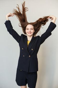 The model girl waves her hair. Expression of emotions.