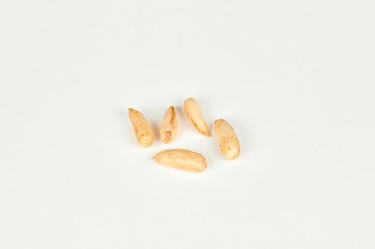 Wild Uzbek papershell almonds 'kaymak' on a white background