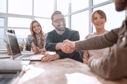 handshake business people at a meeting in the office. the concept of partnership .