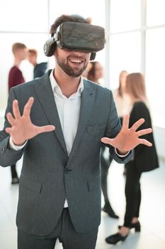 close up. a young businessman in a virtual reality helmet. people and technology