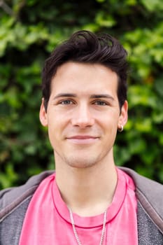 horizontal portrait of a handsome young man smiling, concept of happiness and teenager lifestyle