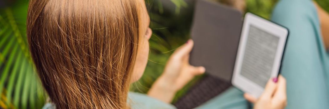 Woman reads e-book on deck chair in the garden. BANNER, LONG FORMAT