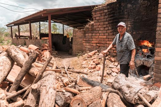 old man touring his brick oven where they make clay blocks in La Paz Centro Nicaragua