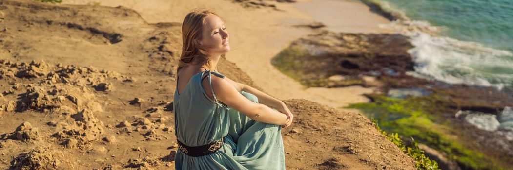 Young woman tourist on Pantai Tegal Wangi Beach, Bali Island, Indonesia. Bali Travel Concept. BANNER, LONG FORMAT